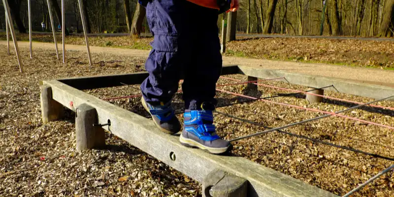 Childcare Learning Stories - Young Boy on a Balance Beam