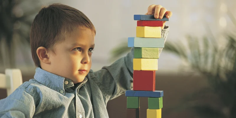 How to Write a Learning Story - Noah Building with Blocks